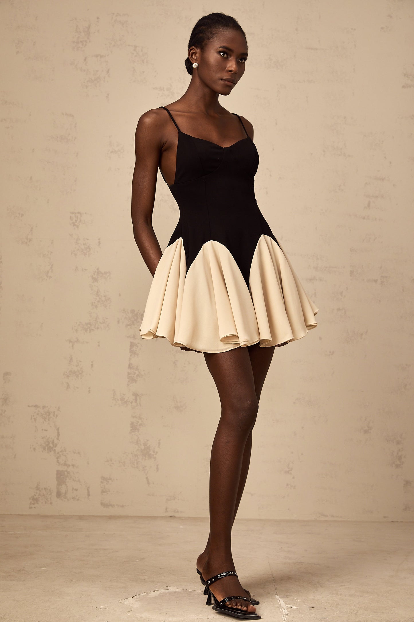 Justine color-blocked godet pleated mini dress