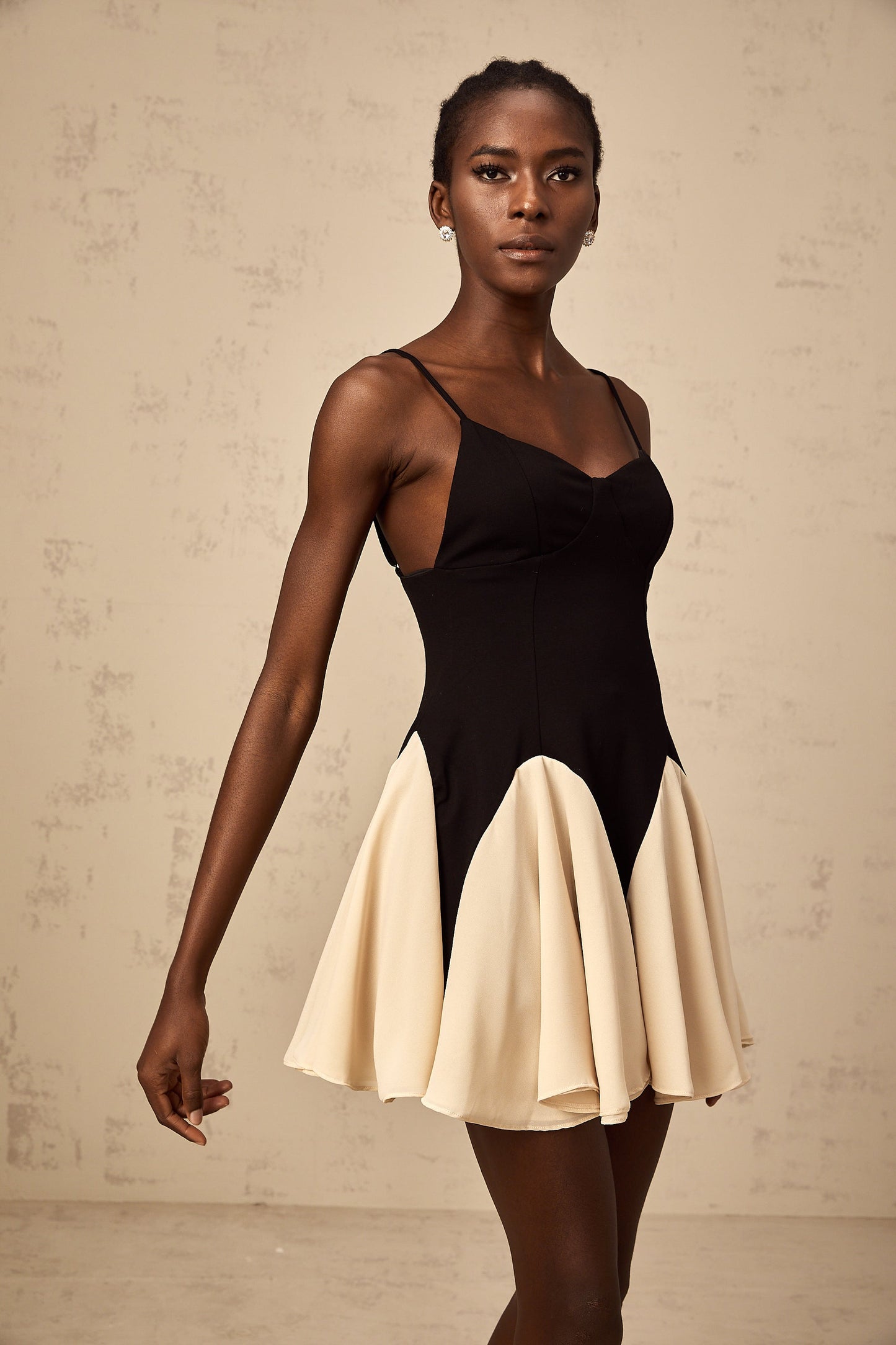 Justine color-blocked godet pleated mini dress