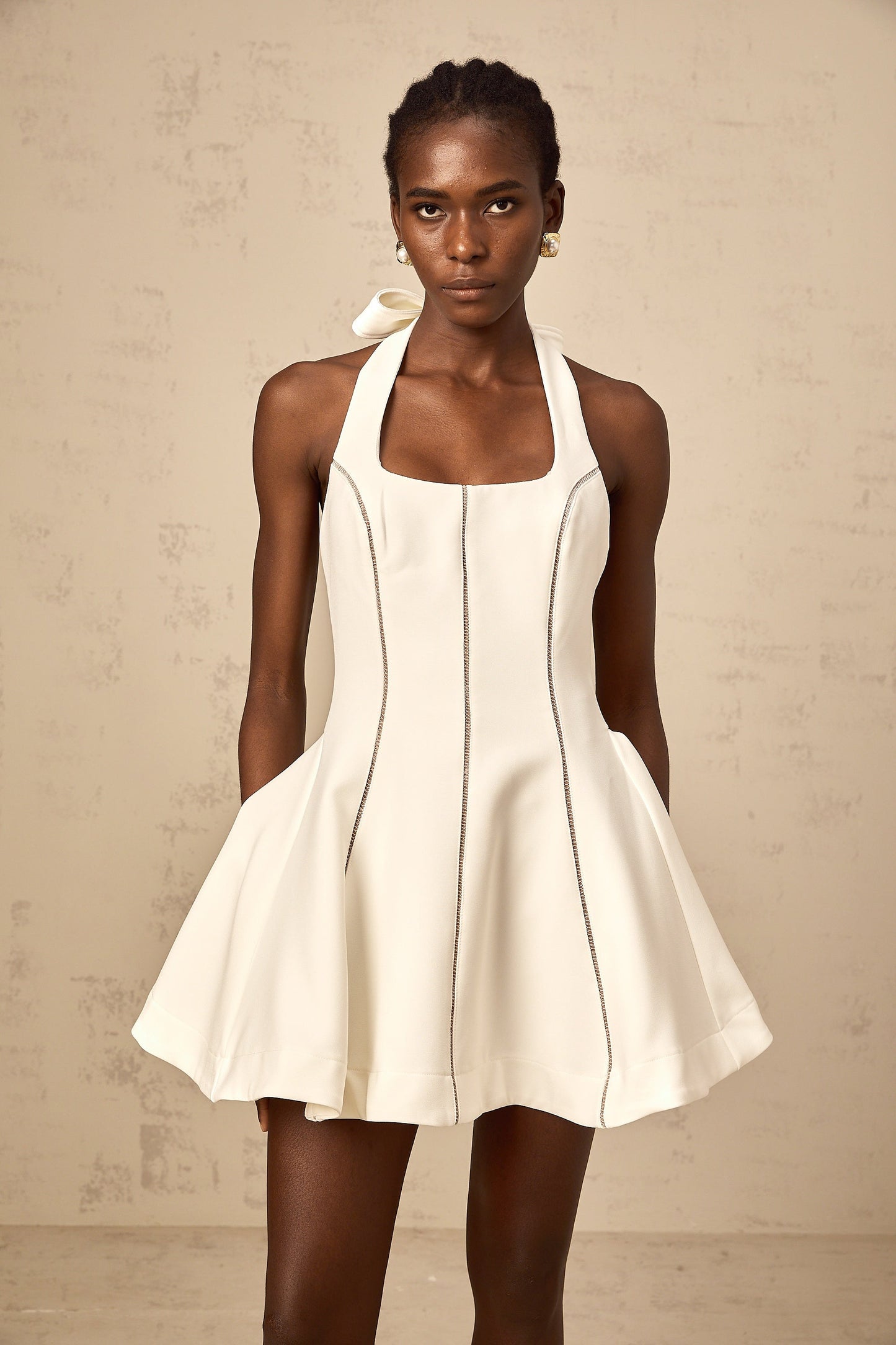 Quirine halterneck bow-detail mini dress in White