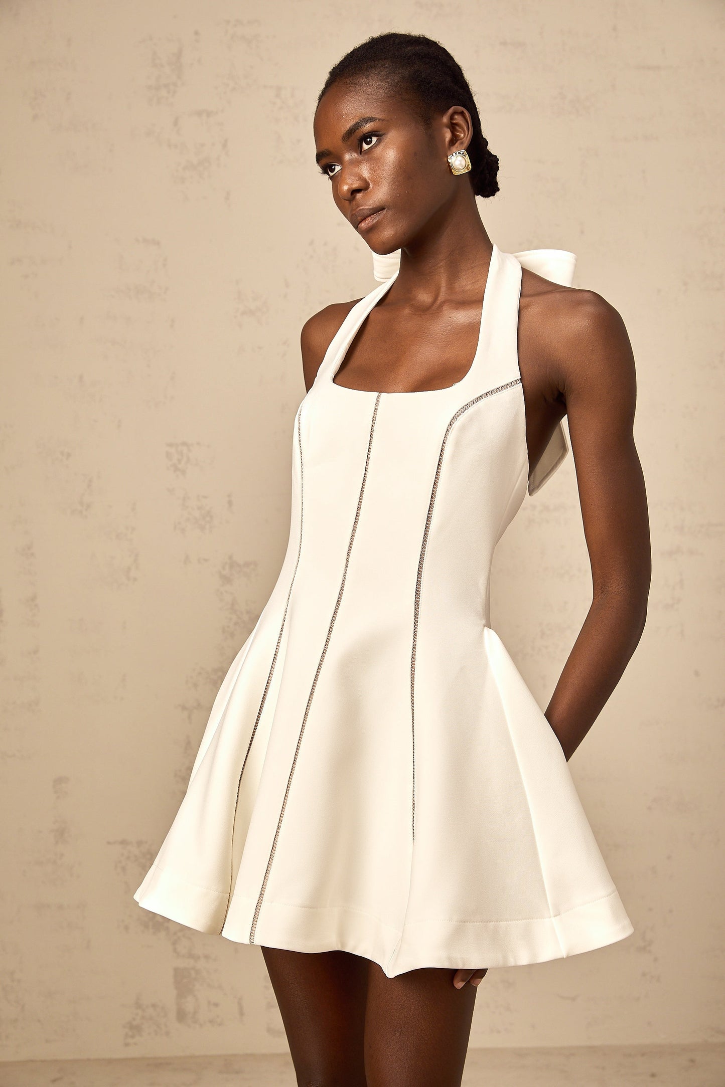 Quirine halterneck bow-detail mini dress in White