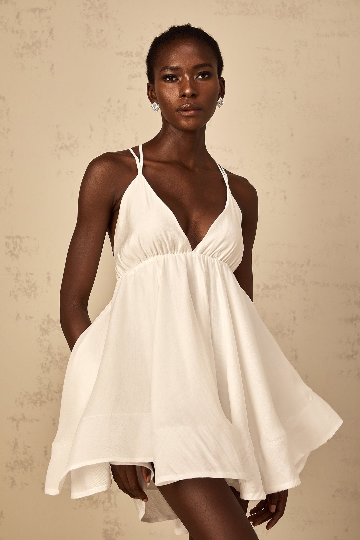 Quincie white shirred flounced mini dress
