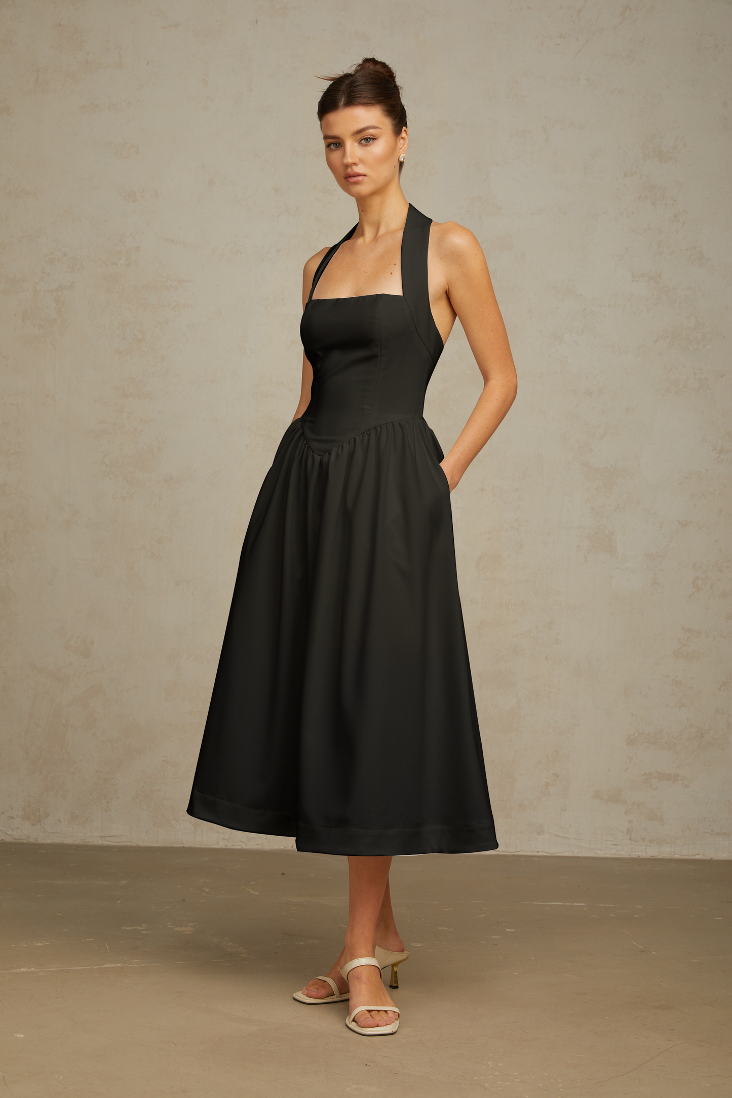 Alizée halterneck pleated midi dress in Black