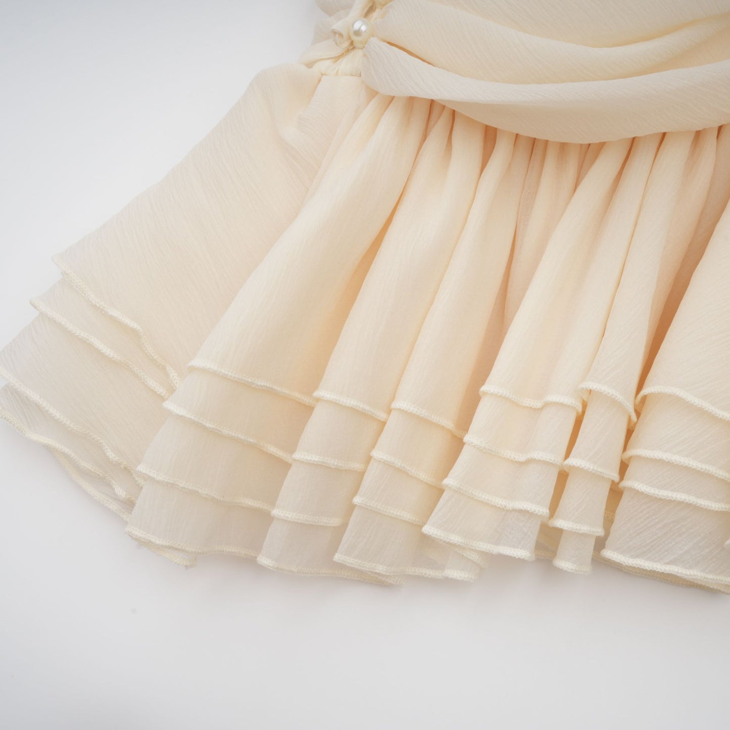 Bérénice white halterneck faux-pearl mini dress