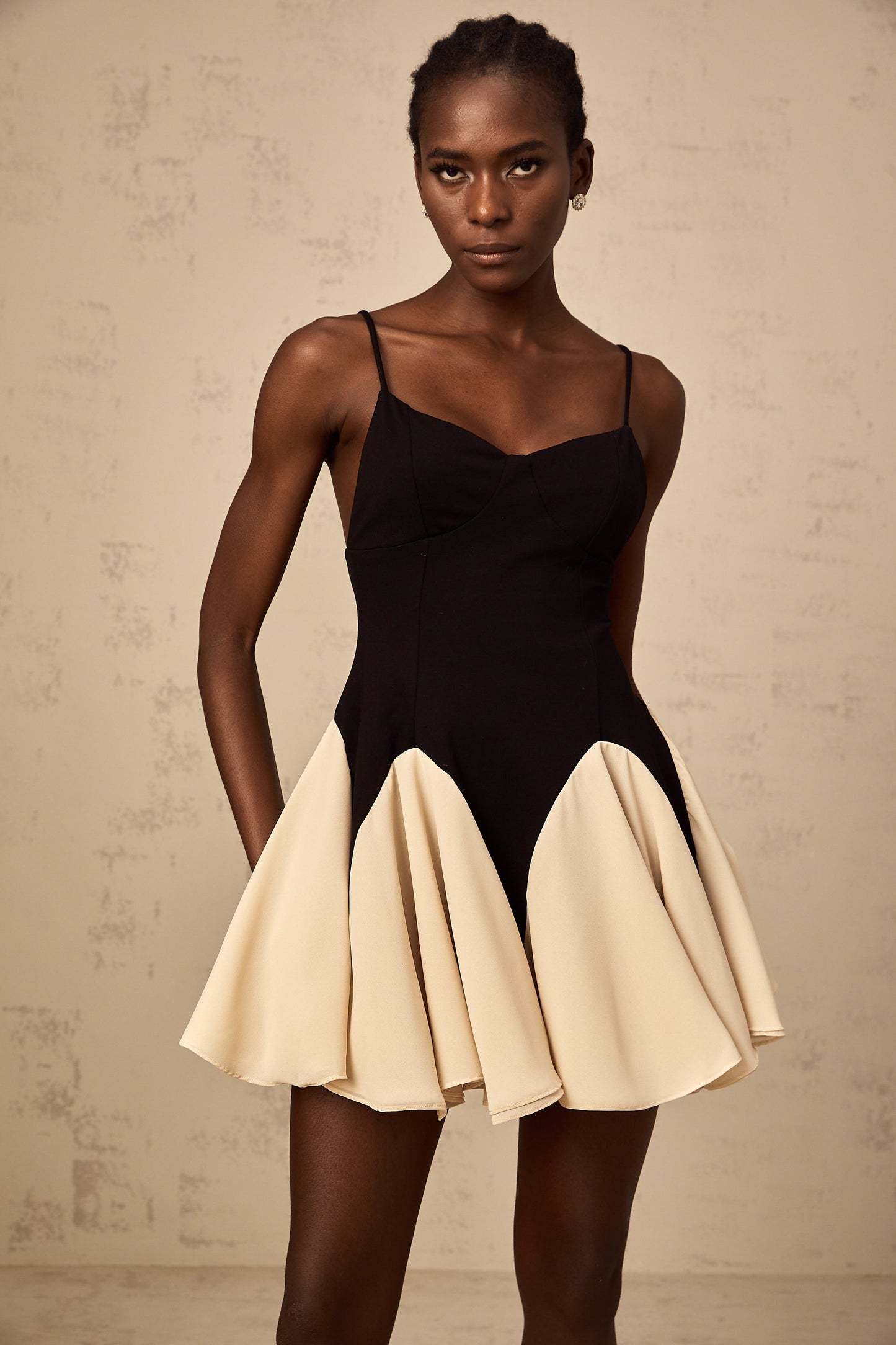 Justine color-blocked godet pleated mini dress